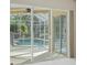 Screened-in pool area with clear blue water and a safety fence at 6977 74Th Street E Cir, Bradenton, FL 34203