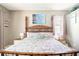 Inviting main bedroom with a decorative four poster bed, and coastal themed accents at 2734 Ashland Ln, North Port, FL 34286