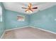 Bedroom featuring a window, ceiling fan and neutral carpet at 2817 Miriam S St, Gulfport, FL 33711