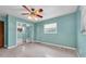 Bedroom featuring a window, ceiling fan and neutral carpet at 2817 Miriam S St, Gulfport, FL 33711