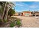 Single story home with a yard of dirt and gravel on a sunny day at 2817 Miriam S St, Gulfport, FL 33711