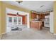 Open-concept kitchen with wood cabinets seamlessly flowing into a large living space at 2817 Miriam S St, Gulfport, FL 33711