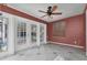 The living room features white framed doors with a ceiling fan and tiled floors at 2817 Miriam S St, Gulfport, FL 33711