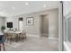 Contemporary dining room with modern furniture, neutral tones, and natural light at 3083 Sikeston Ave, North Port, FL 34286