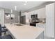 Modern kitchen featuring quartz countertops, stainless steel appliances, and white cabinetry at 3083 Sikeston Ave, North Port, FL 34286