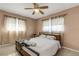 Cozy bedroom featuring a ceiling fan and neutral-toned walls with soft, natural lighting at 3084 Williamsburg St, Sarasota, FL 34231