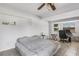 Bedroom with tile floor, ceiling fan, and a sunny window with view of the neighborhood at 3084 Williamsburg St, Sarasota, FL 34231