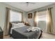 Bright bedroom featuring neutral-toned walls, comfortable bed, and natural lighting at 3084 Williamsburg St, Sarasota, FL 34231