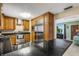 Spacious kitchen with stainless steel appliances and black marble countertops at 3084 Williamsburg St, Sarasota, FL 34231