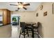 Cozy kitchen area featuring updated appliances, a ceiling fan, and a dining table at 3084 Williamsburg St, Sarasota, FL 34231