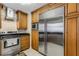 Kitchen featuring stainless steel appliances, granite counters, and wooden cabinetry at 3084 Williamsburg St, Sarasota, FL 34231