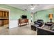 Comfortable living room with a ceiling fan, and neutral decor at 3084 Williamsburg St, Sarasota, FL 34231