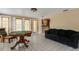 Spacious living room featuring tile floors, a modern ceiling, and a doorway to the kitchen at 3084 Williamsburg St, Sarasota, FL 34231