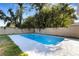 A backyard pool offers a private oasis for relaxation and recreation with mature trees at 3084 Williamsburg St, Sarasota, FL 34231