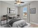 Inviting bedroom featuring natural light, a ceiling fan, and modern décor at 4044 Simkins Ave, North Port, FL 34286