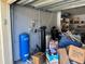 Picture of the garage space with water filtration equipment and storage boxes at 7306 Jones Rd, Odessa, FL 33556