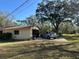 Side angle view of a home with a one car garage at 7306 Jones Rd, Odessa, FL 33556