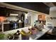 View of a kitchen with a stainless steel refrigerator and a white counter at 7306 Jones Rd, Odessa, FL 33556