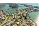 High aerial view of a residential community nestled along a scenic waterway, perfect for boating at 10111 Yacht Club Dr, Treasure Island, FL 33706