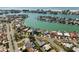 Stunning aerial view of waterfront homes with boat docks in a beautiful coastal community at 10111 Yacht Club Dr, Treasure Island, FL 33706