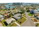 Beautiful aerial view of a neighborhood with waterfront homes near a large bay and modern condos at 10111 Yacht Club Dr, Treasure Island, FL 33706