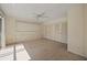 The bedroom features a ceiling fan, neutral carpet, and closet storage at 10111 Yacht Club Dr, Treasure Island, FL 33706