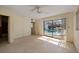 Bedroom features a ceiling fan and sliding glass doors providing access to the pool area at 10111 Yacht Club Dr, Treasure Island, FL 33706