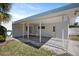 The carport features a covered parking area with a utility door at 10111 Yacht Club Dr, Treasure Island, FL 33706