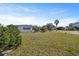 Charming single-story home featuring a spacious yard with mature trees and a cozy screen porch at 10111 Yacht Club Dr, Treasure Island, FL 33706