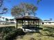 Charming community gazebo providing a shady spot to gather and enjoy the outdoors at 10111 Yacht Club Dr, Treasure Island, FL 33706