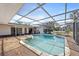 Relaxing screened-in pool area, ideal for outdoor enjoyment and privacy, with well-kept surroundings at 10111 Yacht Club Dr, Treasure Island, FL 33706