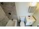 This bathroom features a tub and shower with a tile surround and a single sink vanity at 7120 Waterside Dr # 106, Tampa, FL 33617