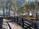Community view with bridge over water and mature landscaping at 7120 Waterside Dr # 106, Tampa, FL 33617