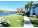 Scenic condo exterior showcasing waterfront views, lush landscaping, and local wildlife at 7120 Waterside Dr # 106, Tampa, FL 33617
