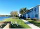 Scenic condo exterior showcasing waterfront views, lush landscaping, and local wildlife at 7120 Waterside Dr # 106, Tampa, FL 33617