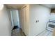 Clean hallway space adjacent to the kitchen, providing seamless access to other rooms at 7120 Waterside Dr # 106, Tampa, FL 33617