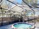 This screened-in hot tub area offers a great space to relax and unwind at 7120 Waterside Dr # 106, Tampa, FL 33617