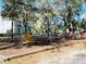 Community playground shaded by mature trees, near the water at 7120 Waterside Dr # 106, Tampa, FL 33617