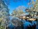 Picturesque water view with reflections, mature trees, and blue skies at 7120 Waterside Dr # 106, Tampa, FL 33617