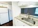 The kitchen is bright and modern with granite counters and updated appliances at 7113 E Bank Dr # 7113, Tampa, FL 33617