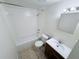 Clean bathroom with a shower-tub combo, vanity, and neutral tile flooring at 7177 E Bank Dr # 102, Tampa, FL 33617