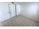 Bedroom with ample closet space and tile flooring, ready for personalization at 7177 E Bank Dr # 102, Tampa, FL 33617