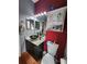 Bathroom featuring a black vessel sink, marble countertop, mirror, and cabinet storage at 10327 Meadow Crossing Dr, Tampa, FL 33647