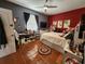 Well-lit bedroom with a ceiling fan, white platform bed with storage, shelves, and a window at 10327 Meadow Crossing Dr, Tampa, FL 33647