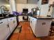 Well-equipped kitchen featuring white cabinetry, stainless steel appliances, and a functional island at 10327 Meadow Crossing Dr, Tampa, FL 33647