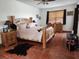 Cozy main bedroom with wooden furniture, ceiling fan, and terracotta tile flooring at 10327 Meadow Crossing Dr, Tampa, FL 33647