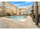 Inviting community pool and patio area is surrounded by attractive multi-story buildings in a desirable neighborhood at 4221 W Spruce St # 2108, Tampa, FL 33607