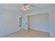 Bedroom featuring hardwood floors, a ceiling fan, and a closet at 4760 Meredith Ln, Sarasota, FL 34241