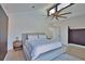 Bedroom featuring a large fan, hardwood floors, and modern furniture at 4760 Meredith Ln, Sarasota, FL 34241