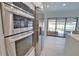 This kitchen features stainless steel LG appliances and overlooks the pool area at 4760 Meredith Ln, Sarasota, FL 34241